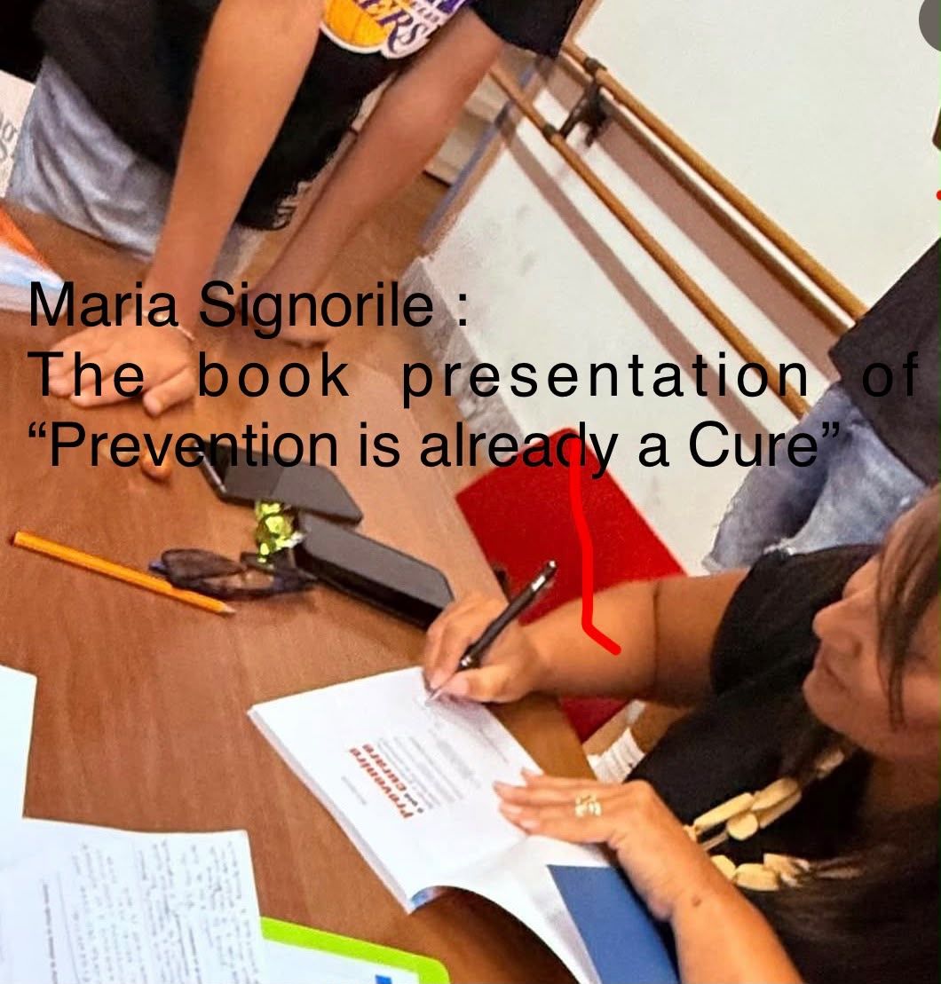 Maria Signorile signing a copy of her book