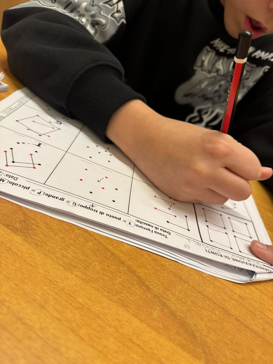 A child working on an Organization of Dots worksheet